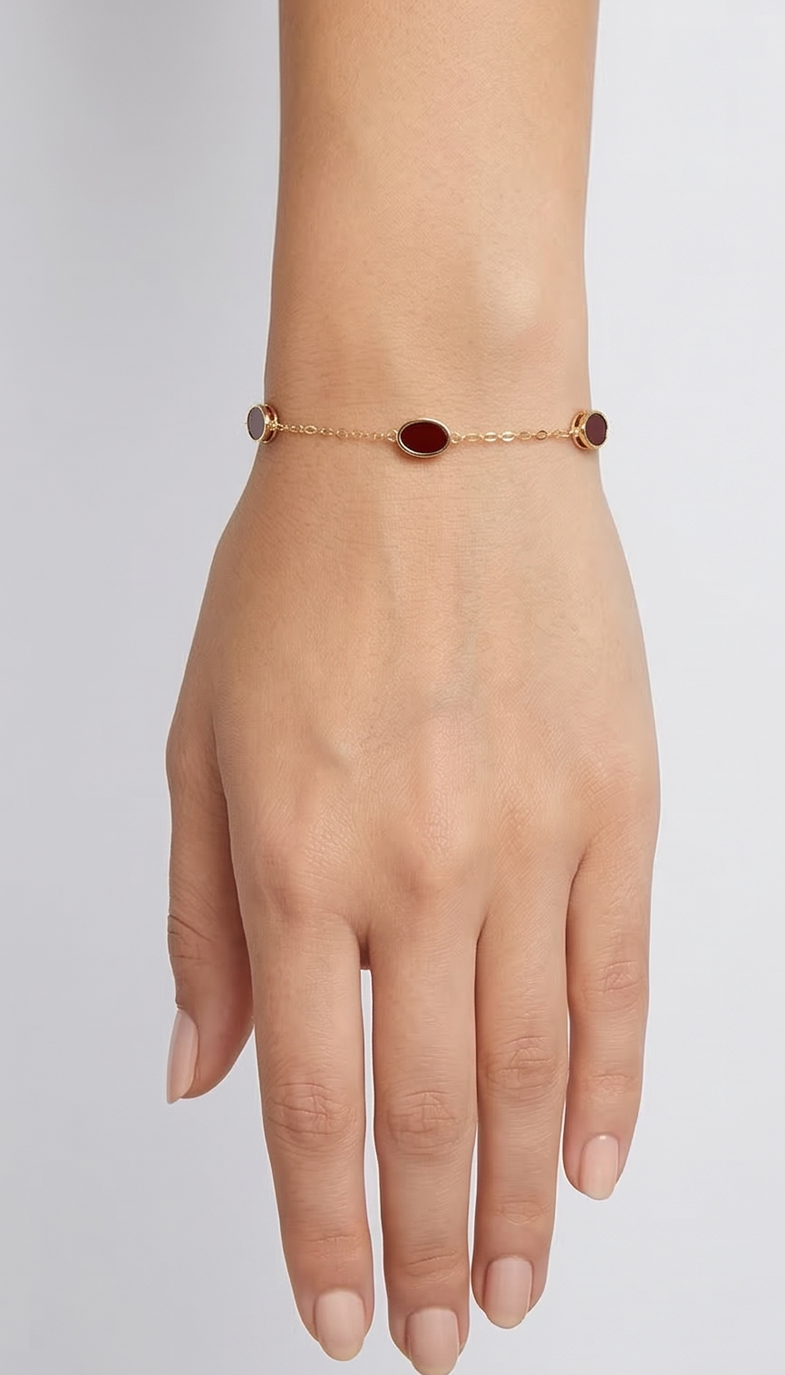 Golden aura: Garnet Glow Oval Station Bracelet